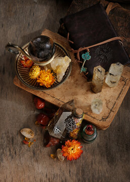 witchcraft items, spell books, amulets and gemstone crystals on wooden table. wiccan Witchcraft. crystal ritual. Esoteric spiritual ceremony for relax, meditation. practical magic. top view