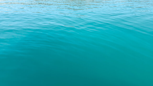 Clear turquoise water surface with gentle ripples, Sainte Croix Lake, Provence-Alpes-Cote d'Azur, France, Europe. 
