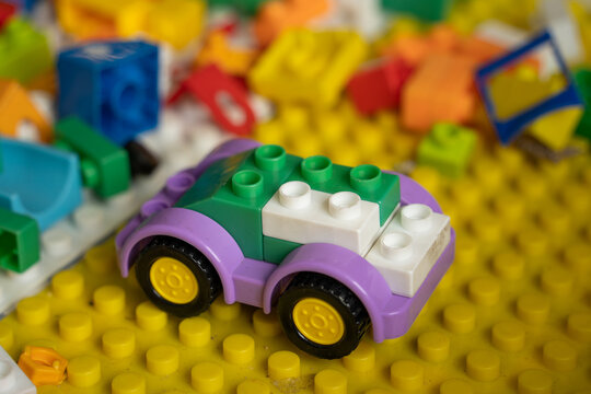 Colorful toy car built from interlocking plastic building blocks
