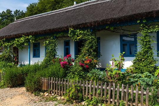 Wooden Fence and Traditional House in Romanian Countryside