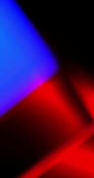Looping Colorful Defocused Lights. Soft orange, pink, red, blue and purple shapes move smoothly across a dark background in a seamless loop. Suitable for modern abstract backgrounds.