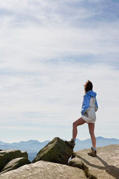 Rear view of woman viewing Adirondack High Peaks from Whiteface Mountain summit
