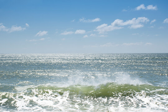 Crest of breaking wave on sunny day