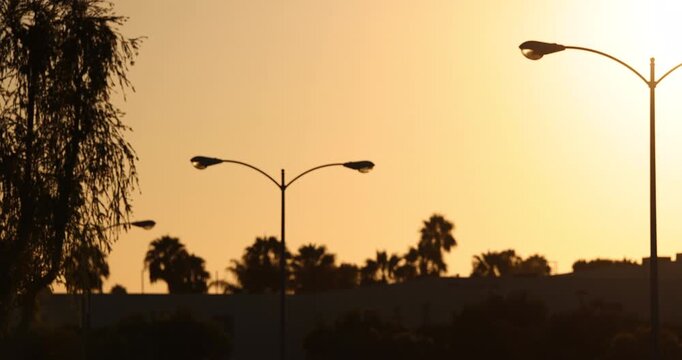 Fullerton, California, USA - July 23, 2026: An AI camera surveils a city street for car license plates.