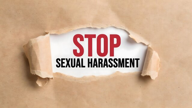 Stop sexual harassment text on a torn paper background concept of awareness and protection against harassment