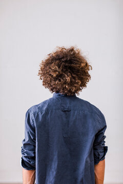 Back view of man with curly hair