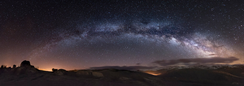 Spain, Milky way over mountains