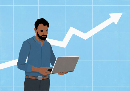 Businessman using laptop in front of ascending arrow on chart