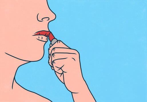 Close up of woman applying lipstick to upper lip against blue background