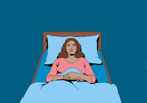 Frustrated woman with insomnia laying in bed and looking up at ceiling