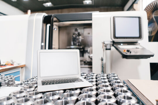 Laptop with blank screen in factory workshop