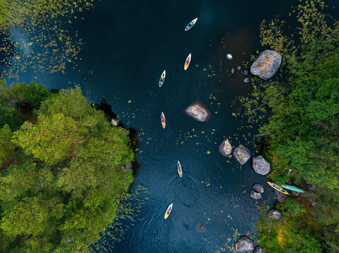 Aerial view of paddleboarders on bank of Vuoksi river
