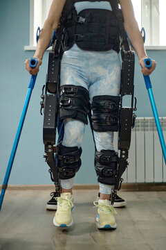 A patient uses an exoskeleton for rehabilitation in a clinic