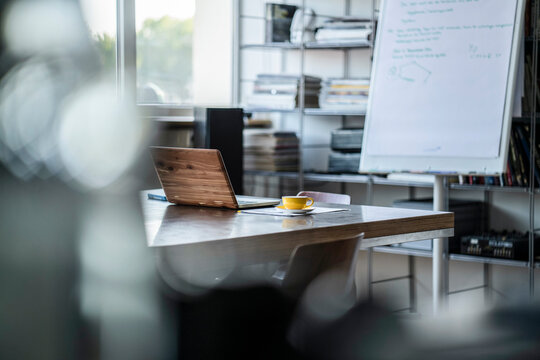 Empty conference room with laptop in office