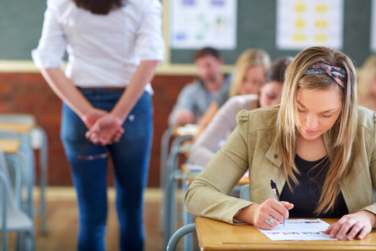 Students in classroom having an exam