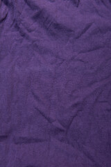 Fototapeta premium Close-up of a dark purple fabric background
