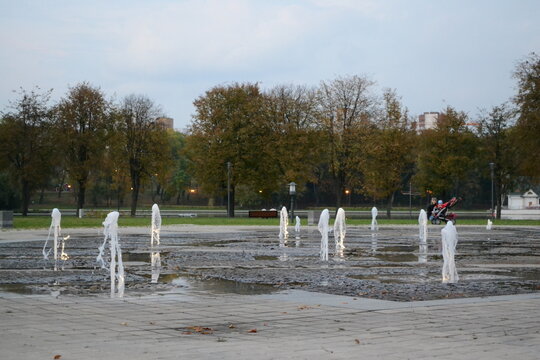 Park in the evening, fountains, lake, river