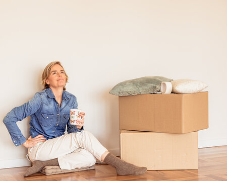 Woman moving house imagining new home possibilities