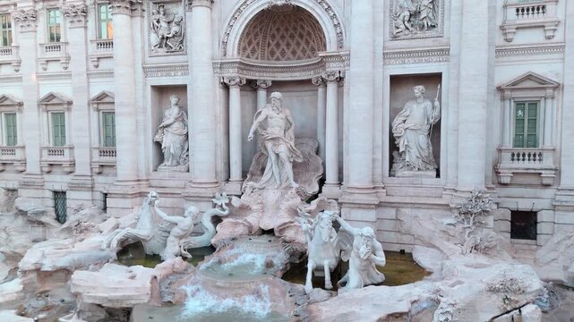 Fontana di Trevi&rsquo;s central marble figures and rocky basin fill the frame as the drone slowly pushes toward the fountain fa&ccedil;ade.
