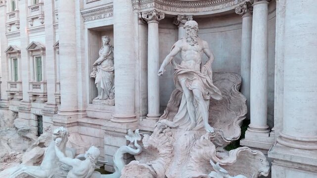 Oceanus and surrounding marble figures at Trevi Fountain fill the frame as the camera glides closely across the baroque facade.