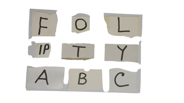 Wooden blocks with letters spelling folly and abc