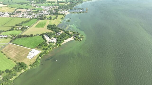 lough neagh in northern ireland almost half covered in toxic blue-green algae