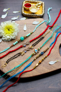 Indian festival Raksha bandhan. Rakhi thali with diya, flowers and tilak with sweet boondi or bundi. Puja thali for rakhi festival with roli chawal. copy space. also known as Narali Purnima. 
