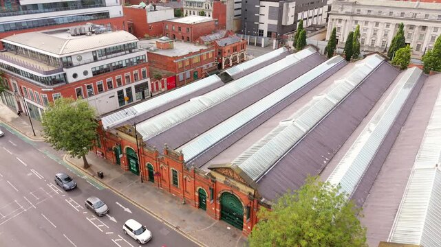 Reversing overhead 4K 50FPS aerial video of St George's Market in Belfast City Centre, Northern Ireland in the UK. Produced in broadcast ready Rec709 color.