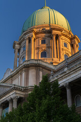 Fototapeta premium illuminated buda castle dome at golden hour in budapest