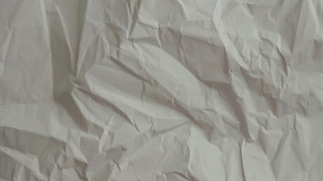 Crumpled paper background animation featuring blue ruled notebook lines and red margin. Seamless looping stop-motion wrinkled texture overlay clip  Apple prores 422, 4k, stopmotion
