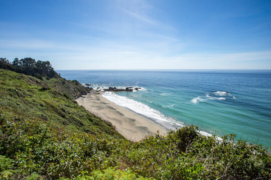 Calm ocean waves washing Big Sur coast