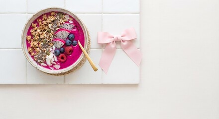 Naklejka premium Pink Dragon Fruit Smoothie Bowl with Granola and Ribbon, Healthy Breakfast Concept for Social Media Marketing