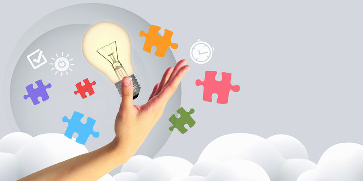 Creative problem solving for business success with a mobile phone and light bulb surrounded by puzzle pieces