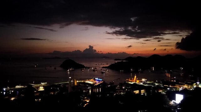 Harbour of Labuan Bajo at sunset, Ost Nusa Tenggara, Flores, Indonesia, Southeast Asia. Time lapse of harbour Labuan Bajo. Island Monyet on the left, Islands Bajo, Kelapa and Seture on the right.
