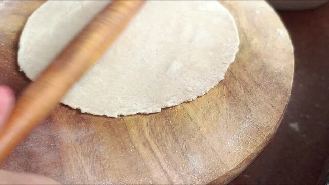 Rolling Roti Dough on Wooden Board - Indian Woman Making Chapati with Rolling Pin