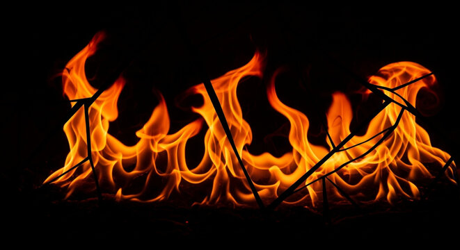 Fiery blaze, abstract embers, dark background, vibrant orange and yellow flames