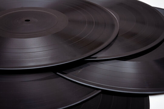 Group of black vintage records. Vinyl records texture, music background. View of phonograph records.