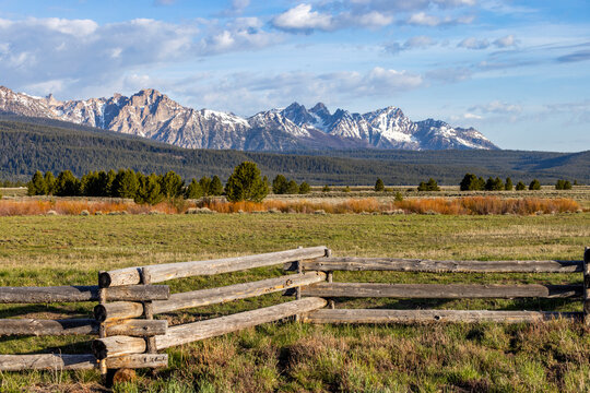 Rustic wooden fence with Sawtooth Mountains in background