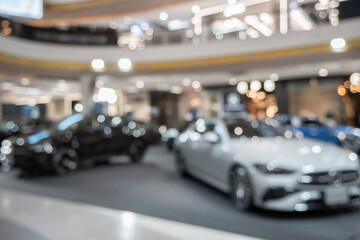 new cars in showroom interior blurred abstract background © Kwangmoozaa