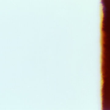 Blank grained film strip texture background with heavy grain, dust and light leak