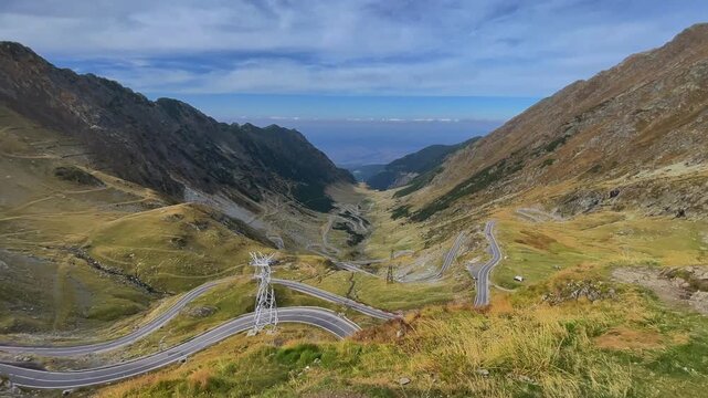 Panoramic View of Transfagarasan Road Winding Through the Fagaras Mountains in Romania. Concept of scenic travel, mountain routes and Carpathian landscapes.