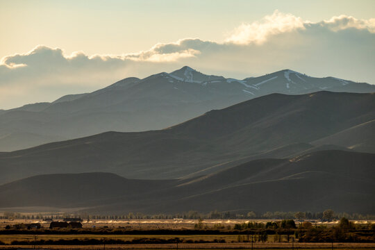Clouds above mountains at sunset