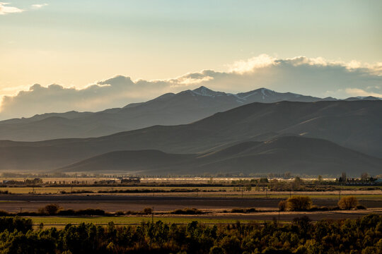 Clouds above mountains at sunset