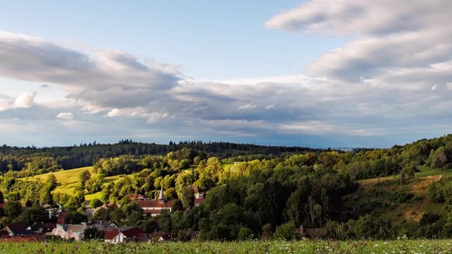 Time-lapse of Clouds Moving Over a Scenic European Village 4K UHD