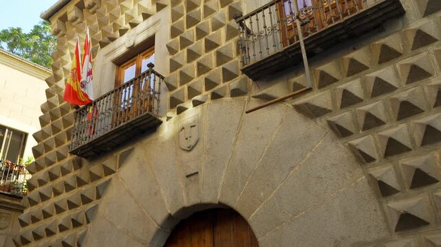 Historic Casa de los Picos facade with diamond shaped granite stone pattern in Segovia Spain