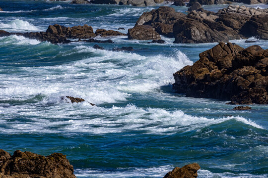 Ocean waves crashing against rocks at 17-Mile Drive