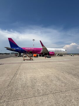Commercial passenger airplane of Wizz Air on the airport during ground operations, representing modern low cost carrier travel and the aviation industry in Milan Malpensa Airport, Italy 11 July 2026