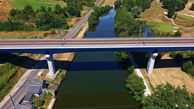 Drone flying toward a railway bridge crossing the Mayenne River near Chang&eacute;, France.