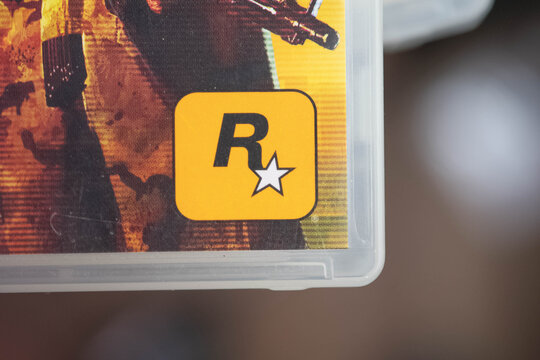 Rockstar game developer logo on used playstation game box, copy space background image physical game, market collectors, second hand