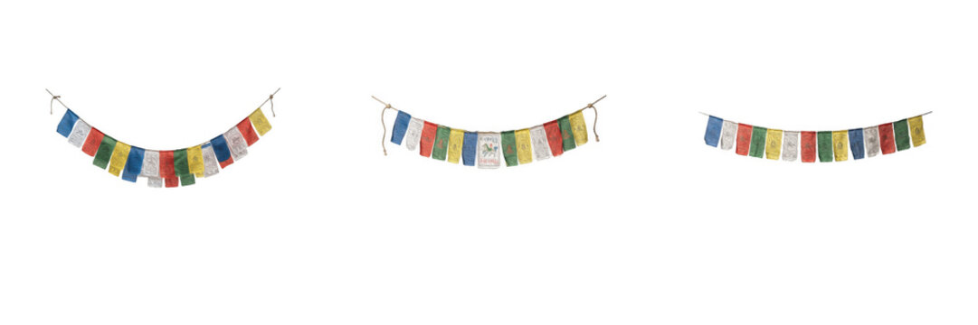 Colorful Tibetan prayer flags strung on cords and hanging in rows isolated on white background cultural photography elements